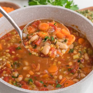 Soup in the pot with spoon.