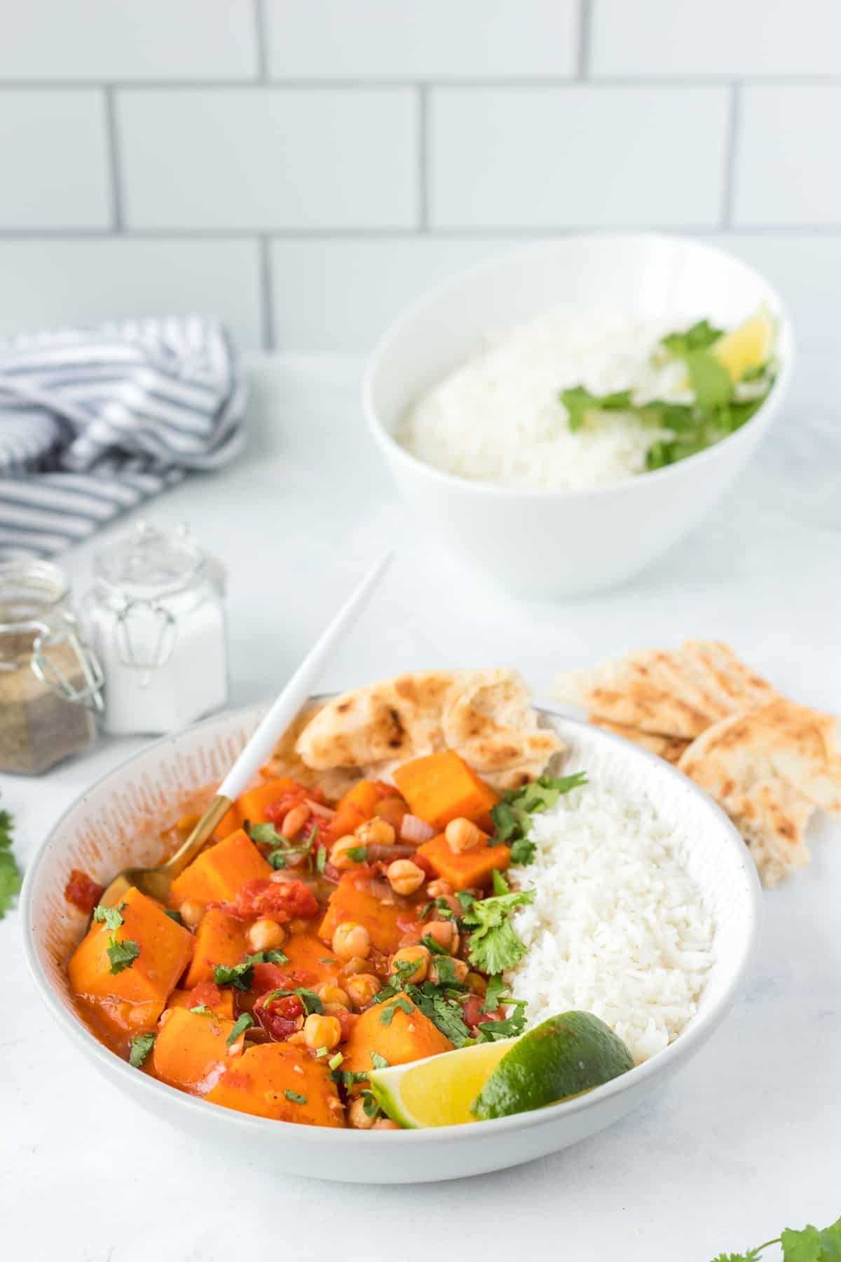 Stew serve in a bowl with rice and a fork 