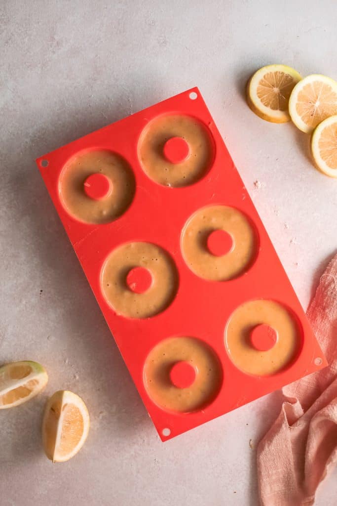 Donuts batter in the donut pan.