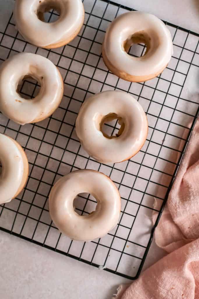 Donuts on a cooling rack top view.