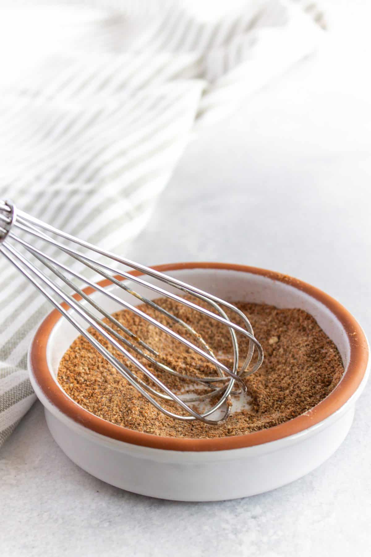 Mixing the spices in a small bowl 