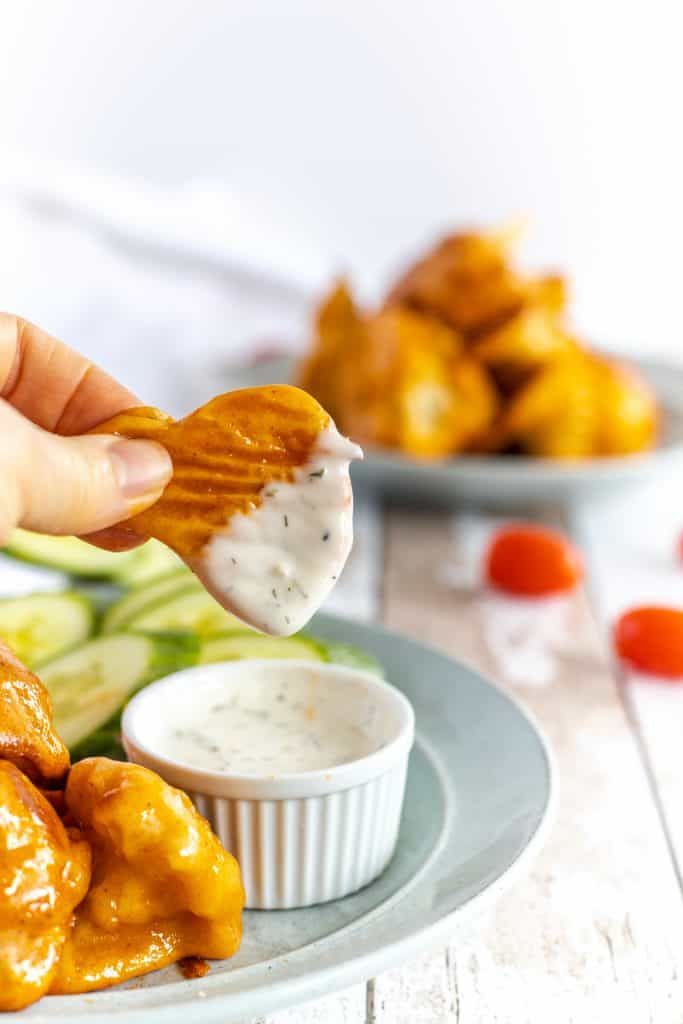 dipping the wing in the vegan ranch
