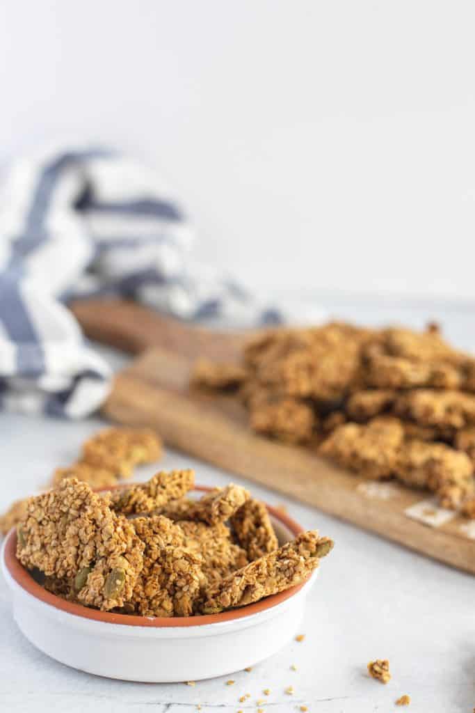 Pieces of granola cluster in a small bowl