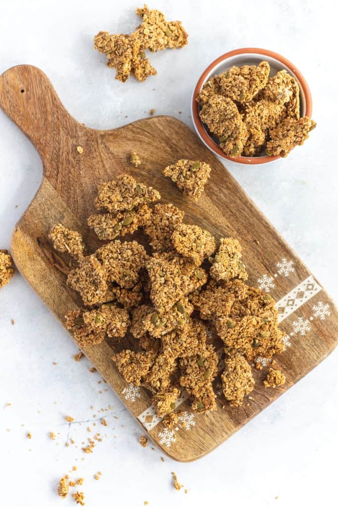 Pieces of granola Cluster on a wooden board 