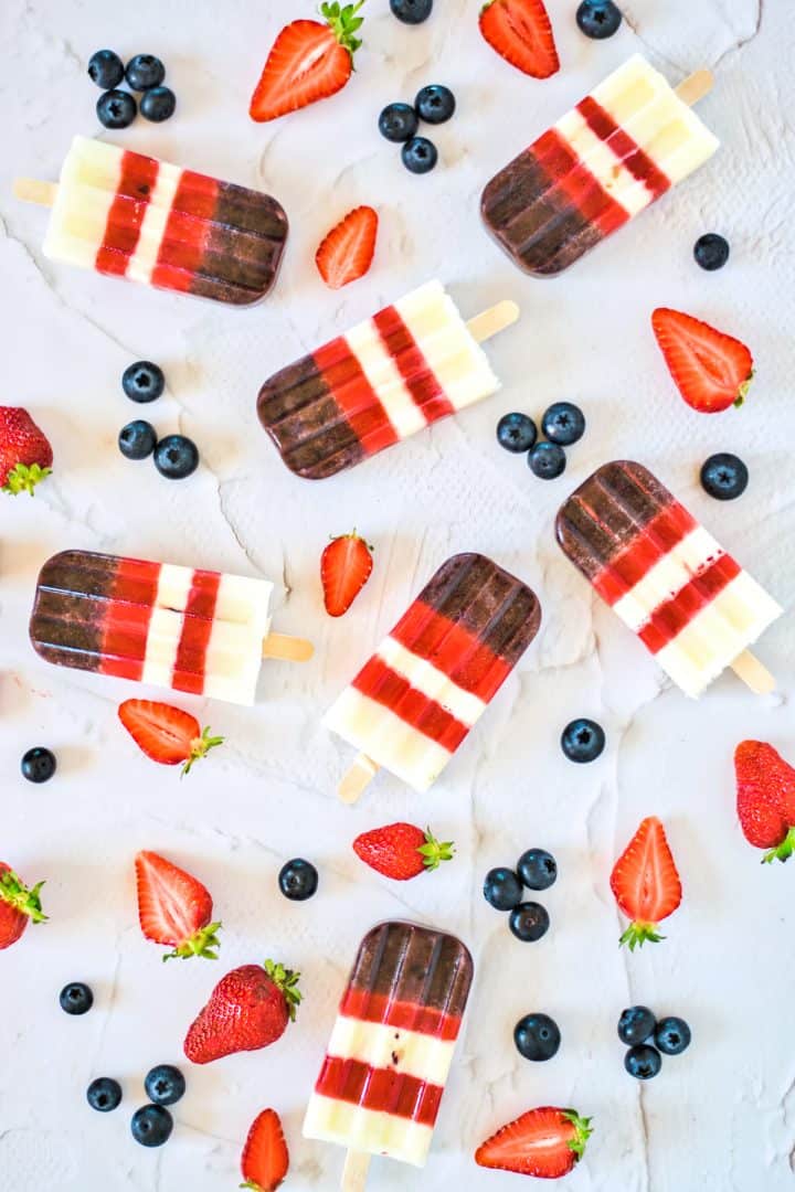 berries popsicles with fresh blueberries and strawberries top view