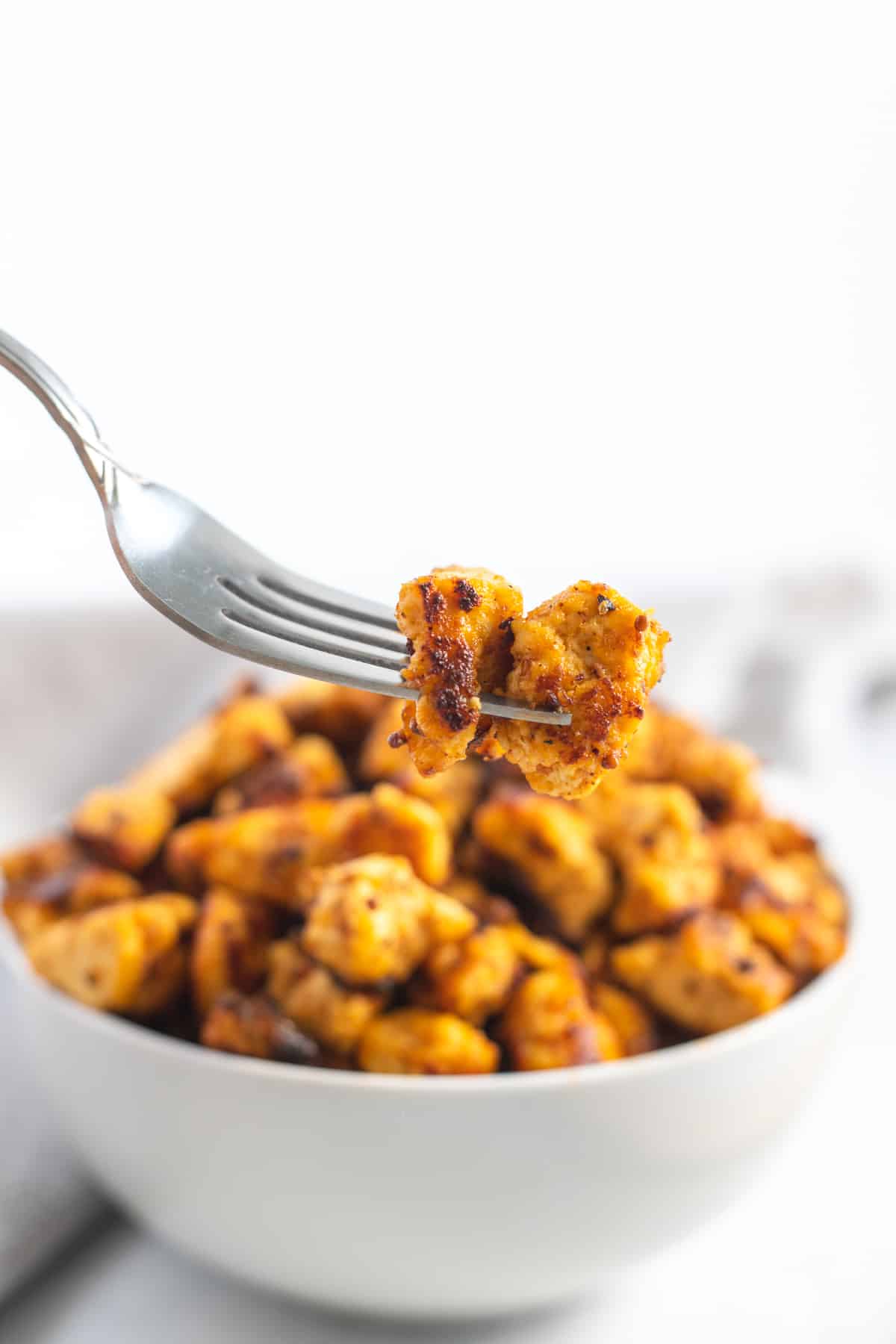 Savory Baked Tofu  on a fork close up 