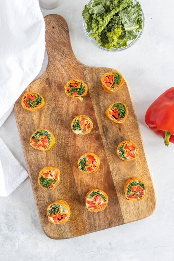 Vegan pinwheel in a wooden cutting board 