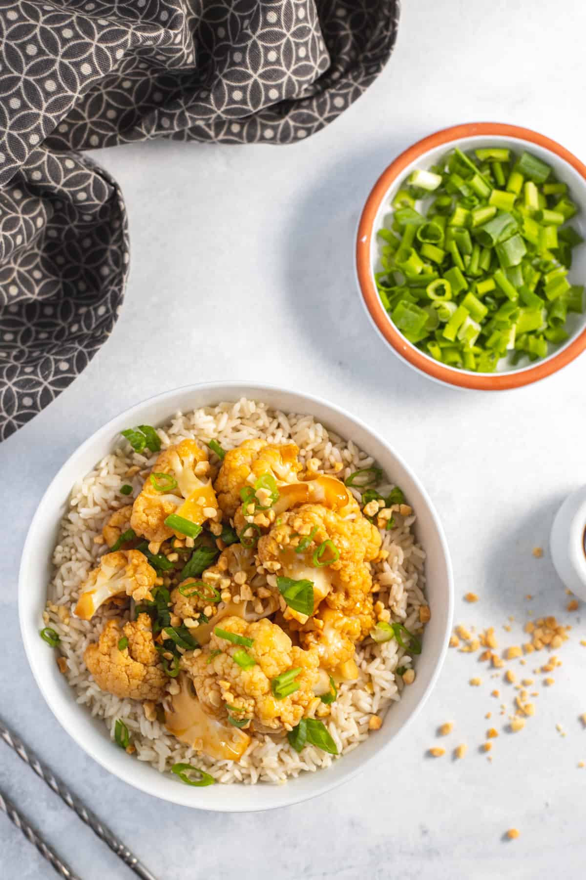 Vegan kung Pao Cauliflower in the Instant Pot in a bowl over rice top view