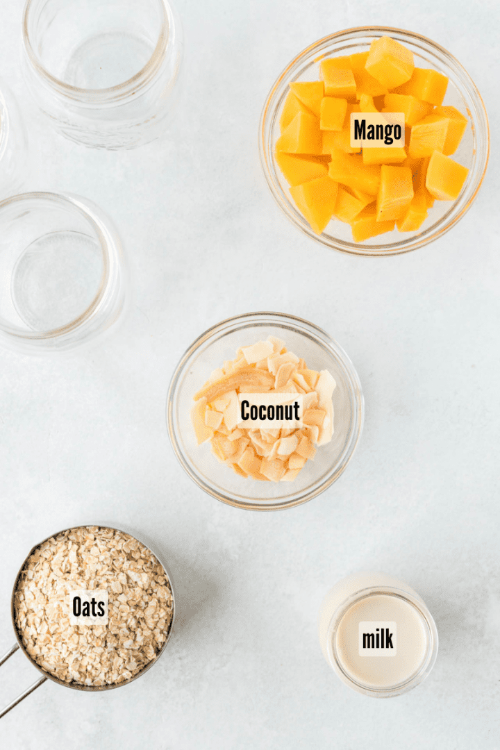 All the ingredients you need to make this recipe. Mango, oats, milk, coconut
