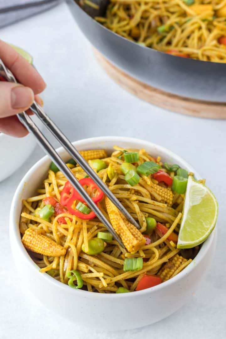 Chop stick with bowl of Singapore noodle