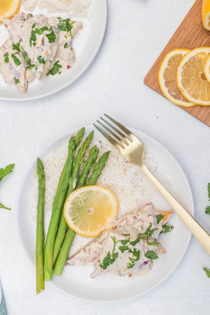 Top view of the tofu serve with asparagus rice and slice of lemon