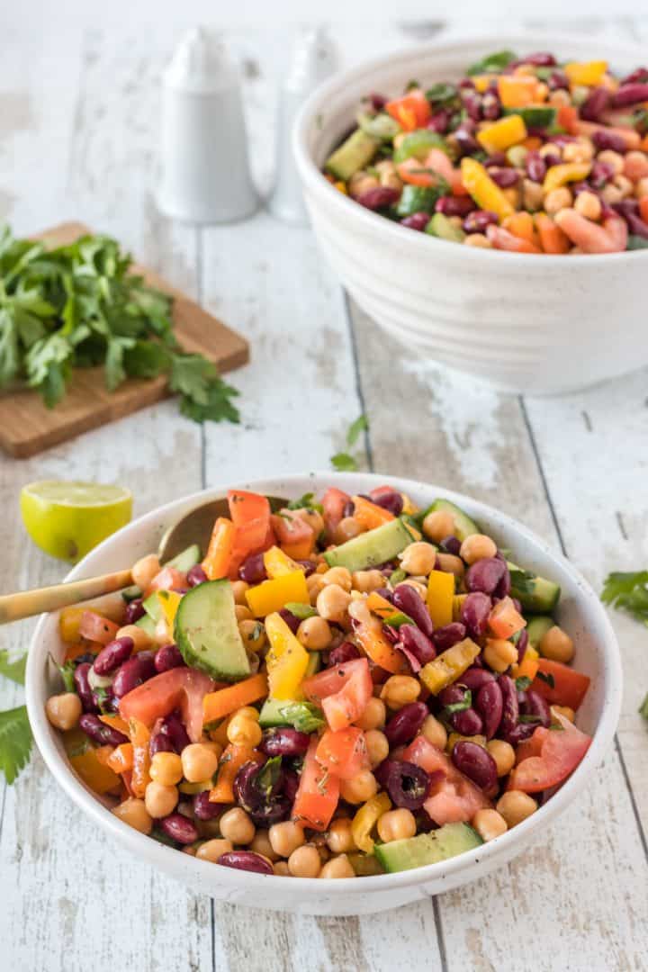 Vegan High Protein bean Salad serve in a bowl with spoon 
