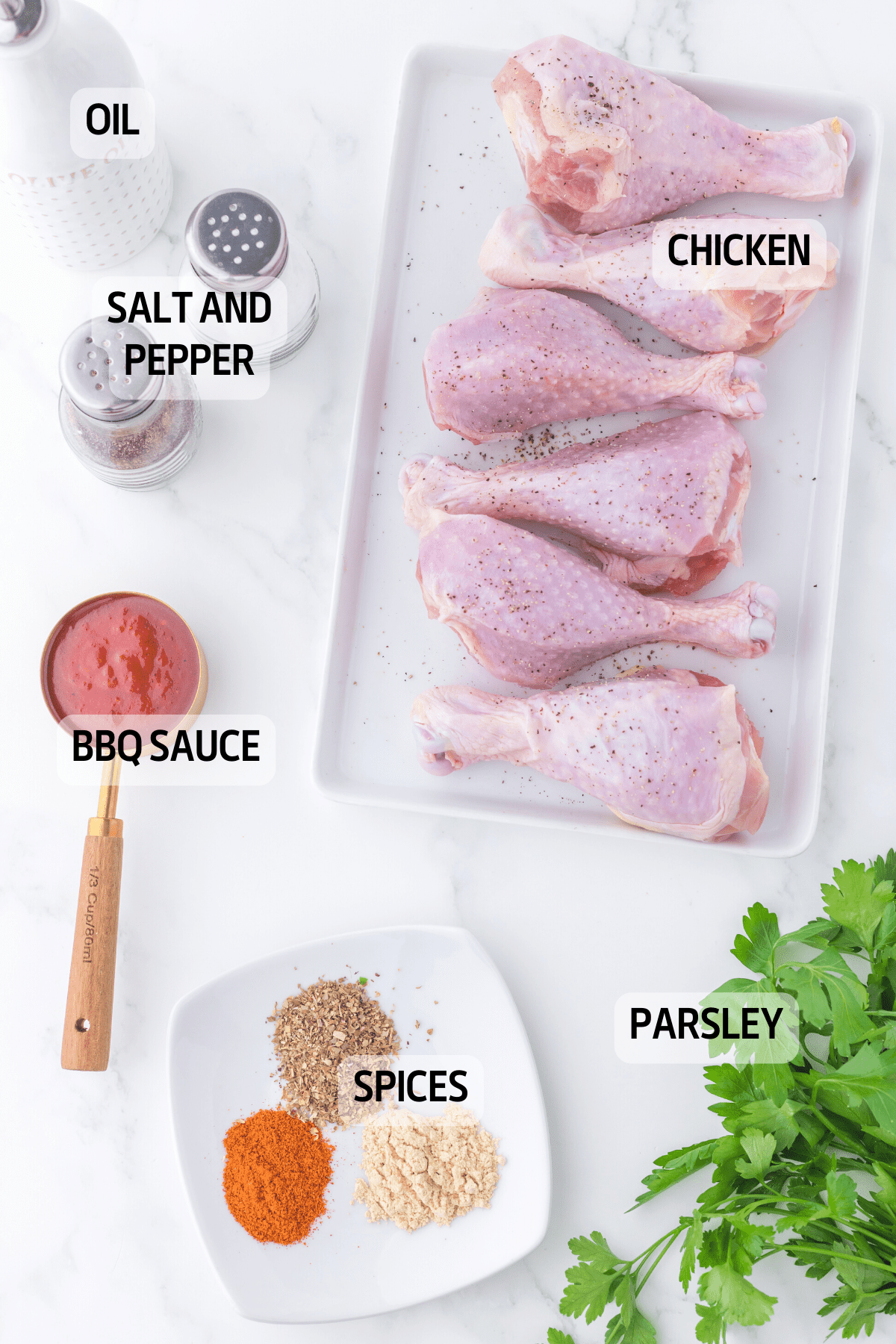 the ingredients you need to make this recipes
chicken drumsticks with skin
chili
oregano     
garlic powder
salt
black pepper
olive oil
 barbecue sauce
 parsley 
nonstick cooking spray