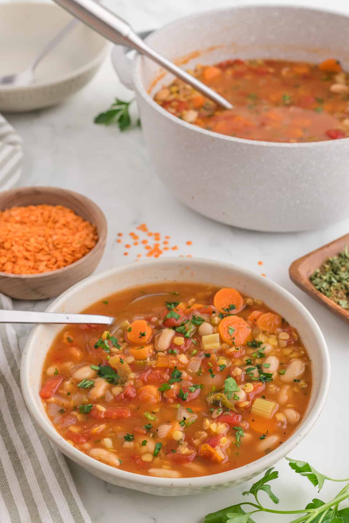 Soup in a bowl with a spoon.