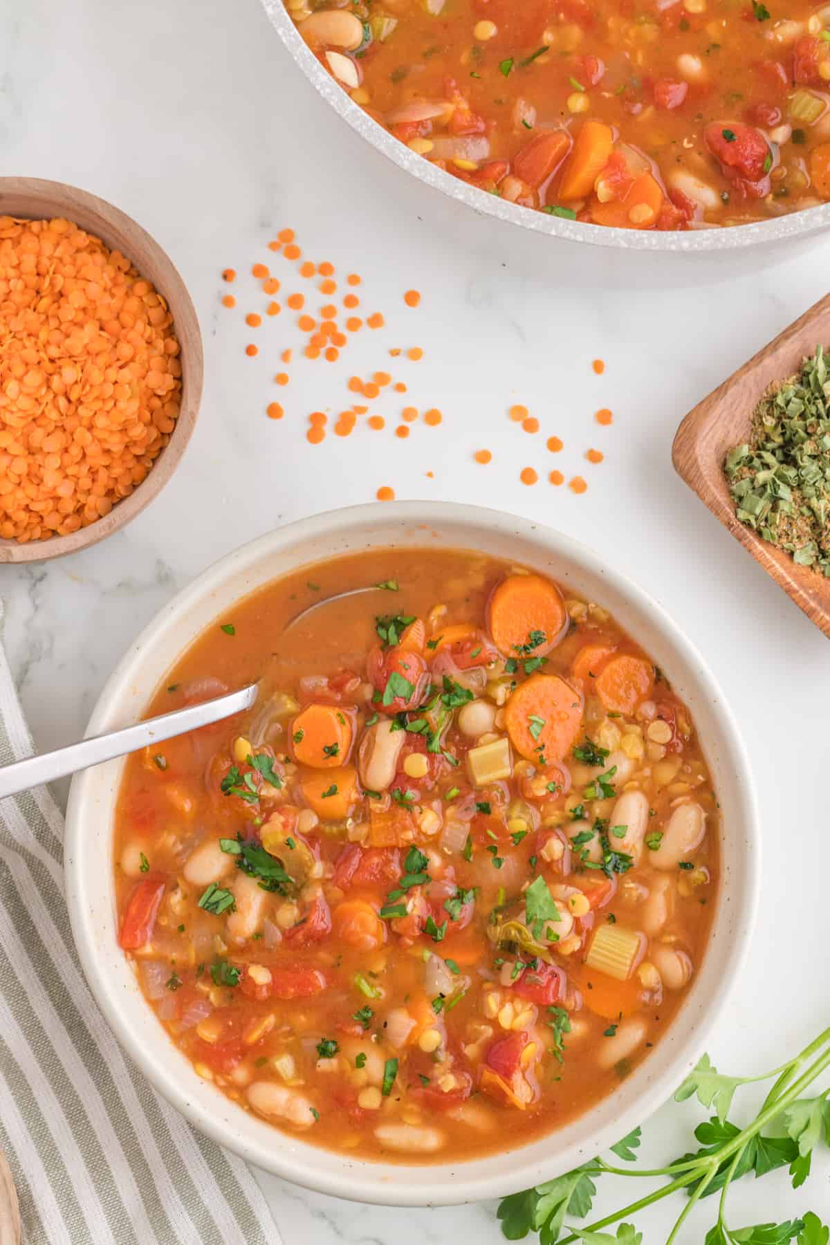 Bowl of soup with spoon top view.