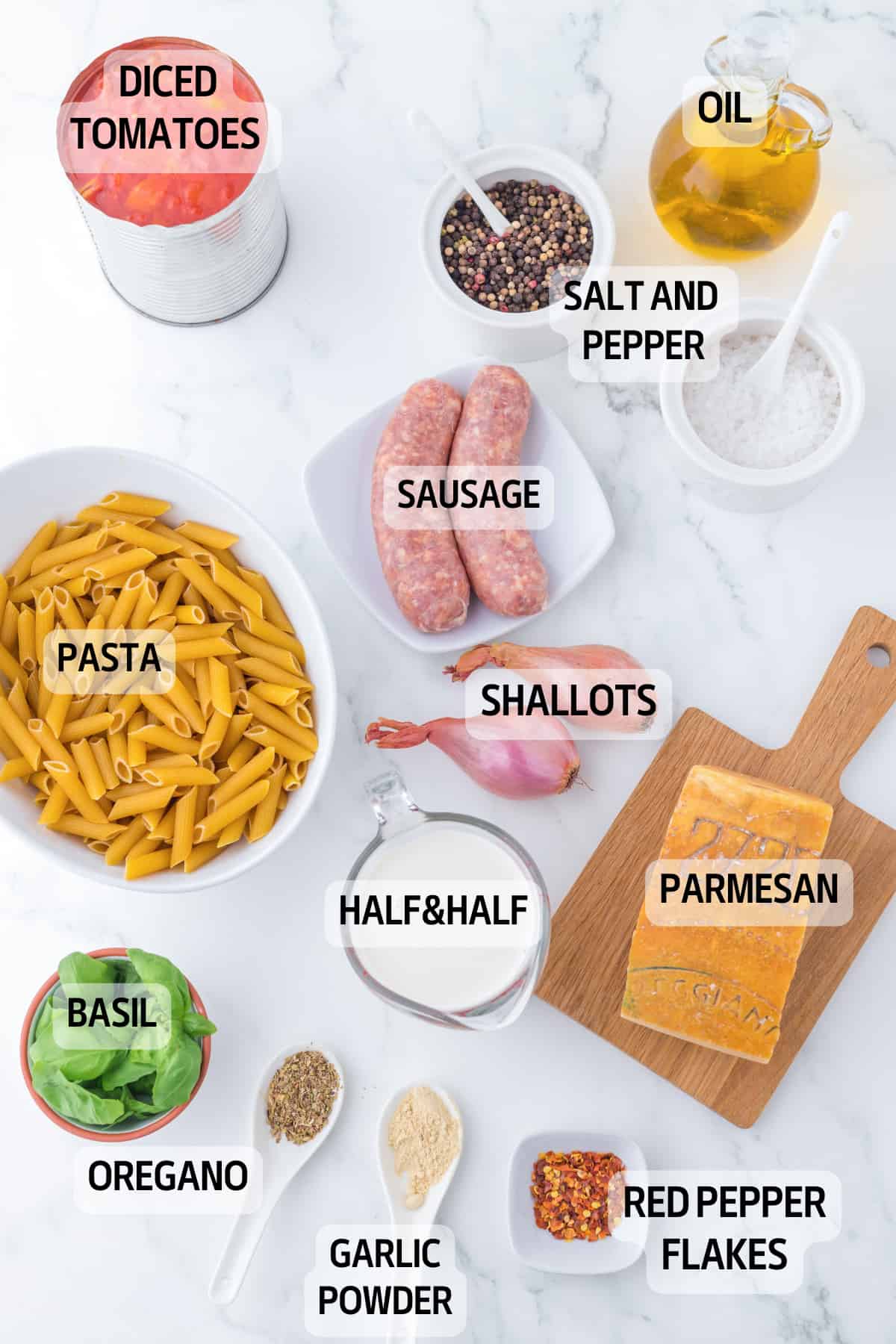 All the ingredients you need to make this recipe: penne, tomatoes, sausages, parmesan, shallots, spices, half&half.