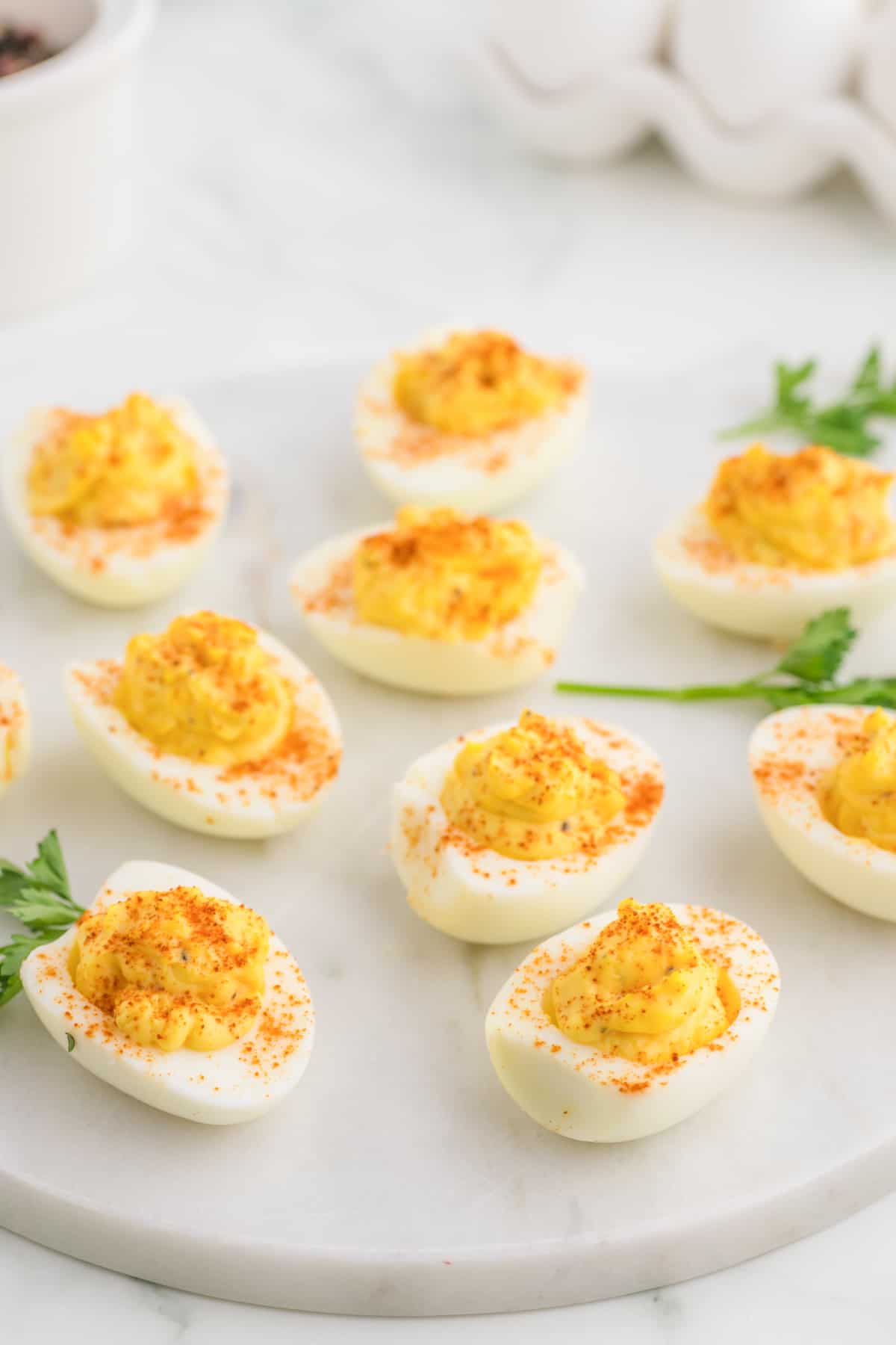 Deviled egg on a marble plate.