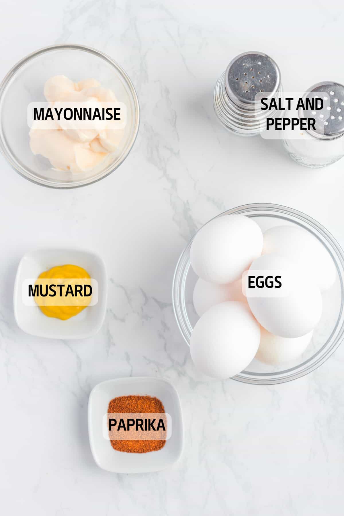 Ingredients you need to make this recipe, eggs, mustards, mayonnaisem paprika, salt and pepper.