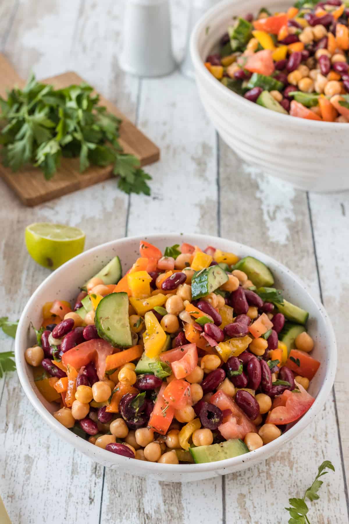  bean Salad serve in a bowl with spoon.