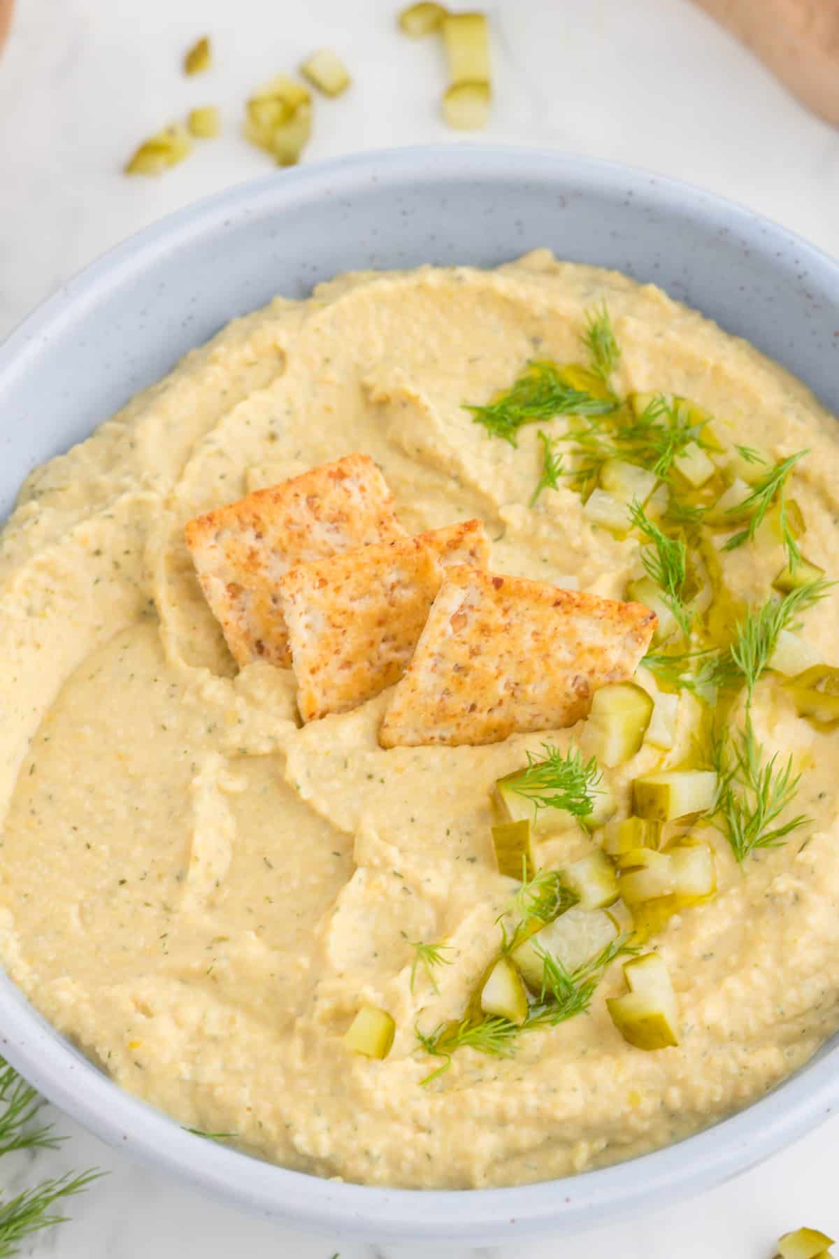 close up on the hummus with crackers.