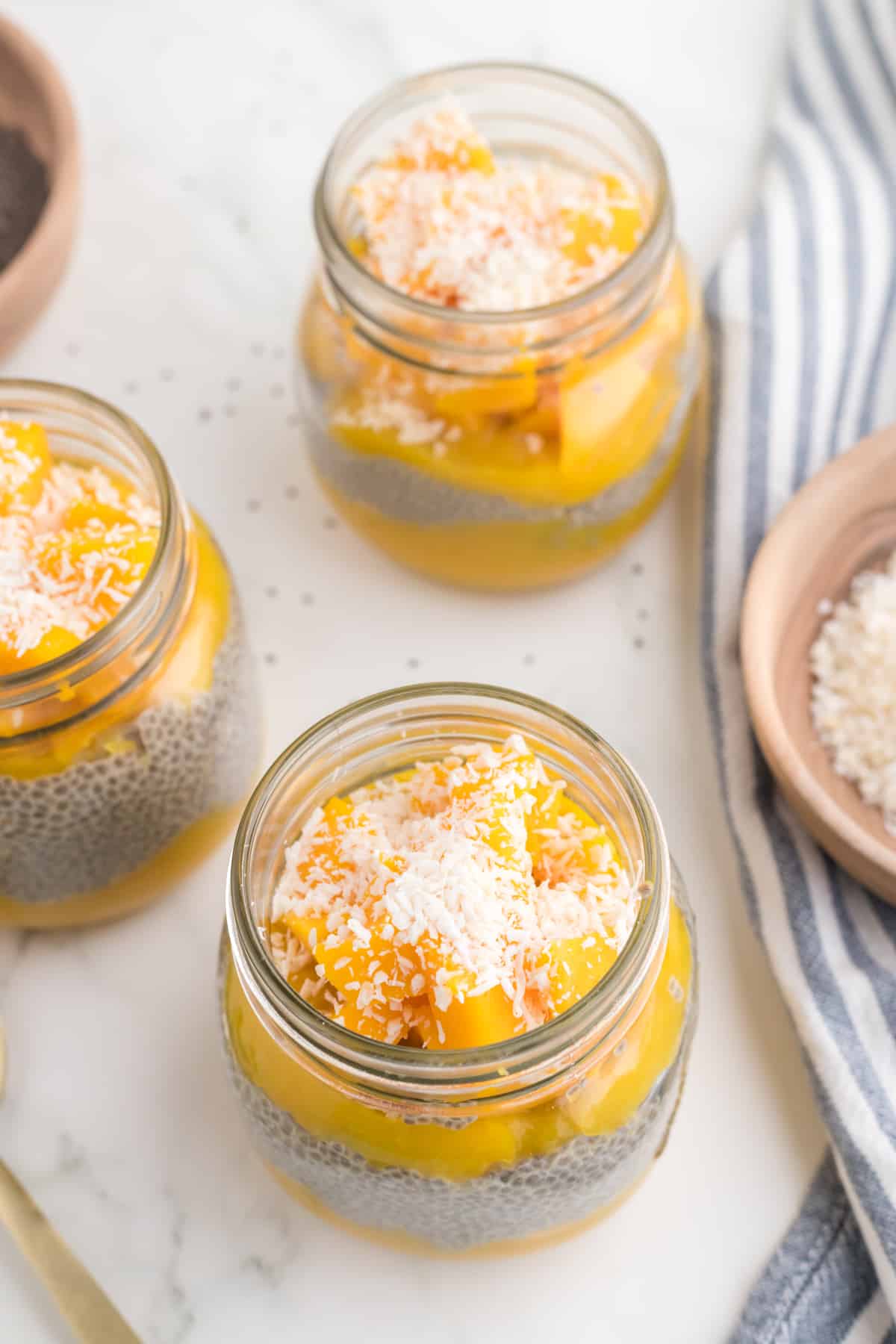 mango chia pudding in a jar top view.