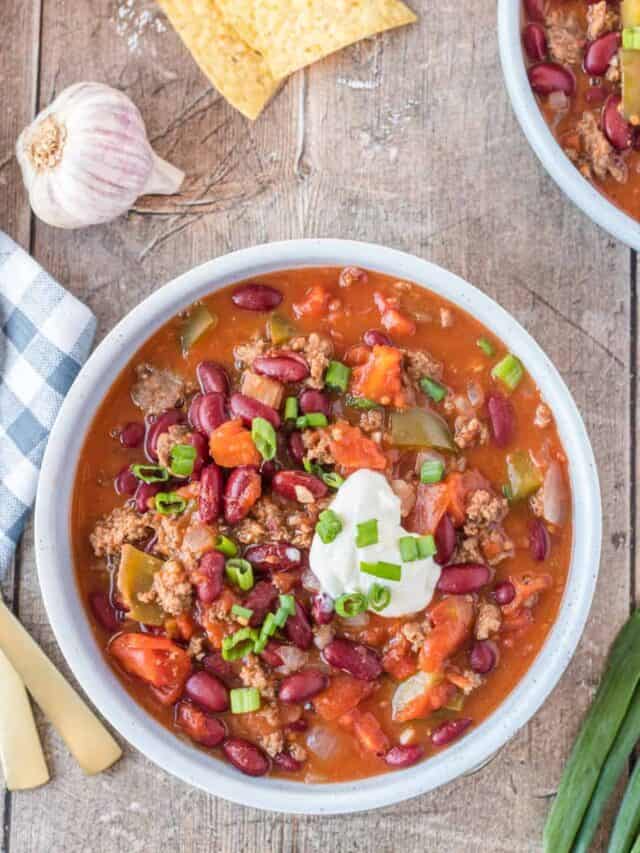 chili serve in a blue bowl, top view.