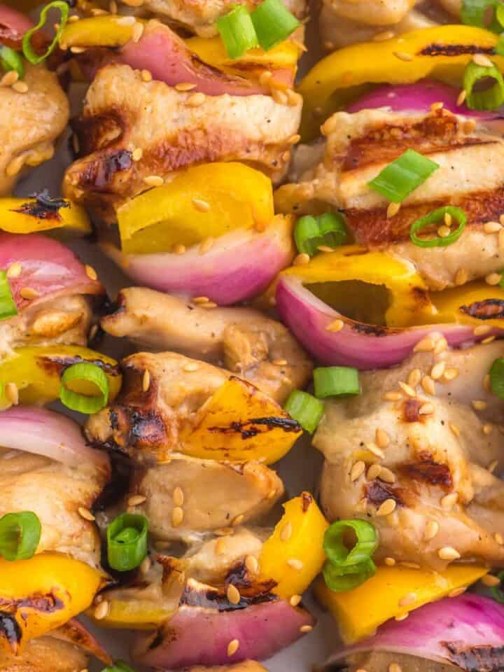 Top view and close up of the cooked teriyaki chicken skewers.