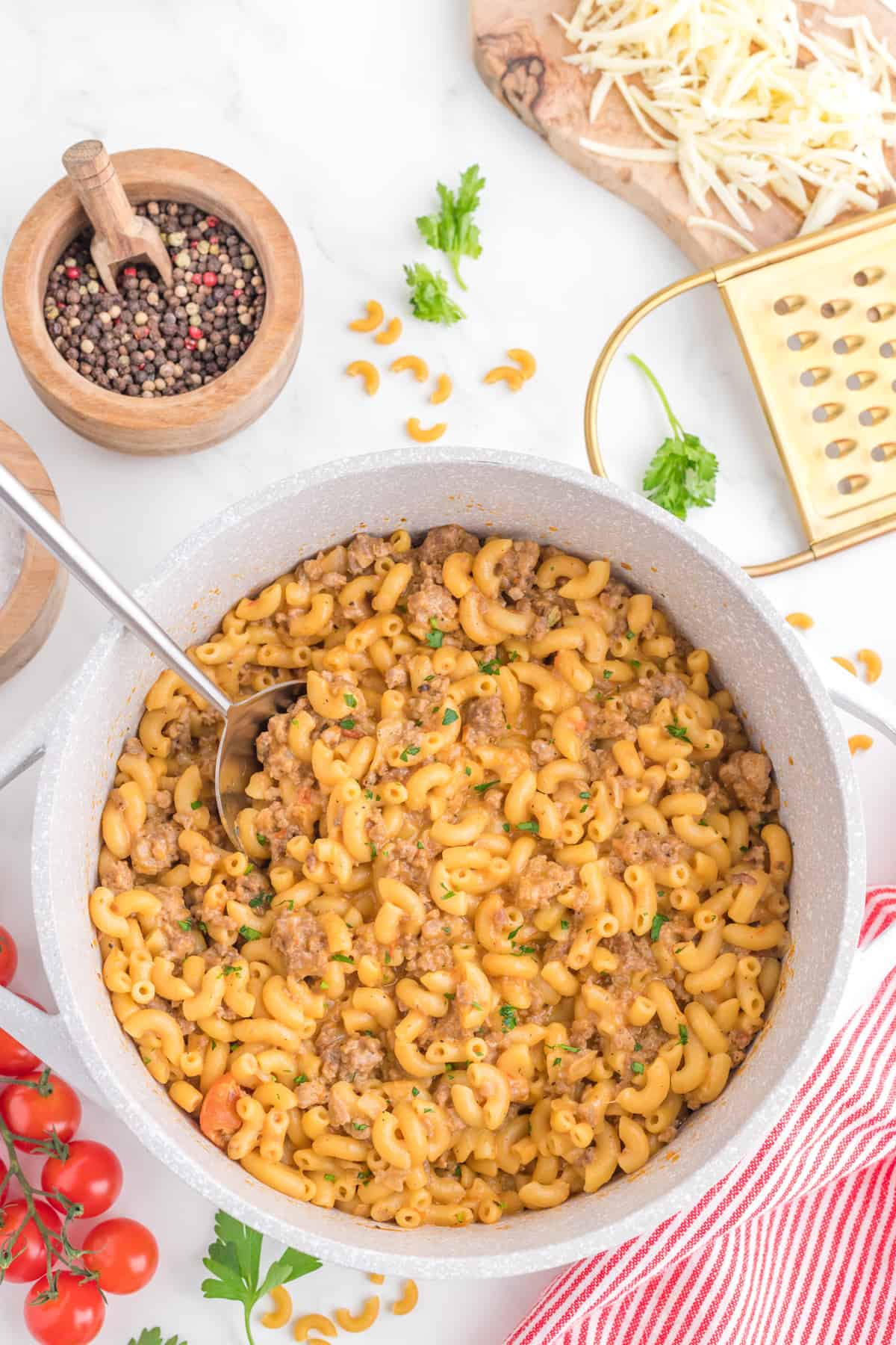 Italian goulash in a pot with a serving spoon.