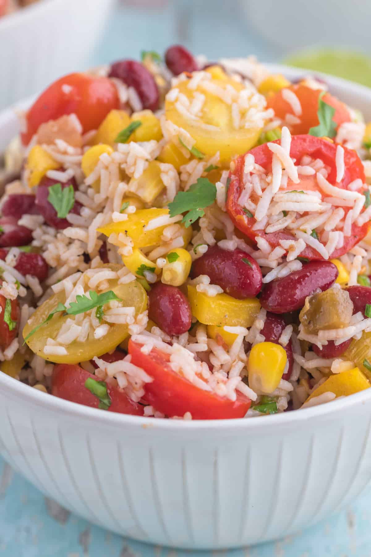 Cold Mexican Rice Salad close up serve in a white bowl.