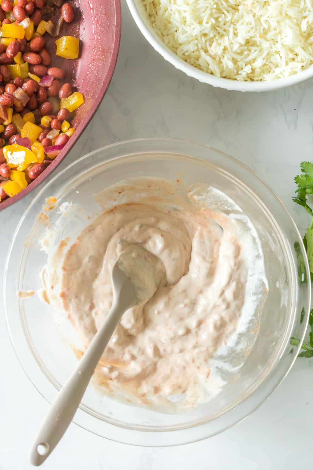 SOUR CREAM AND SALSA MIX IN A BOWL.