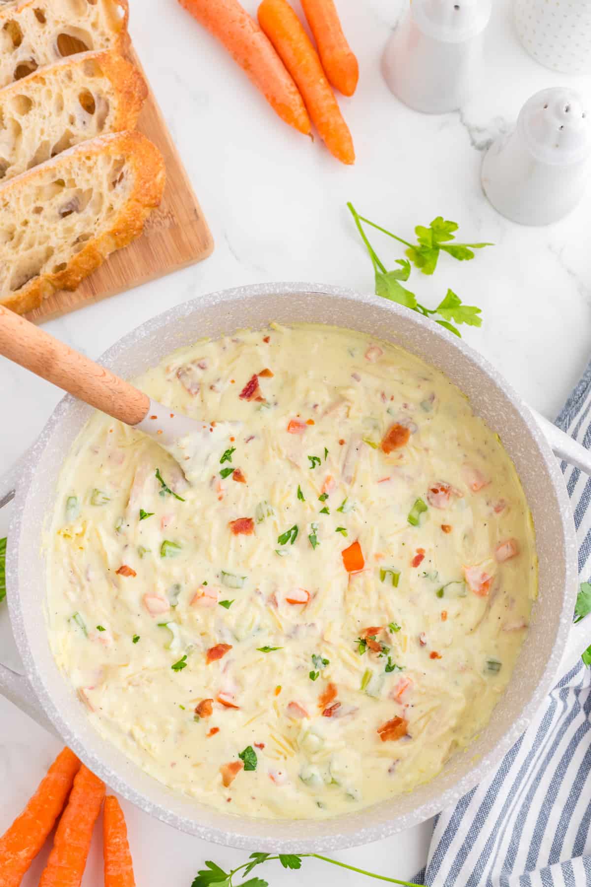 Soup in a pot with ladle top view.