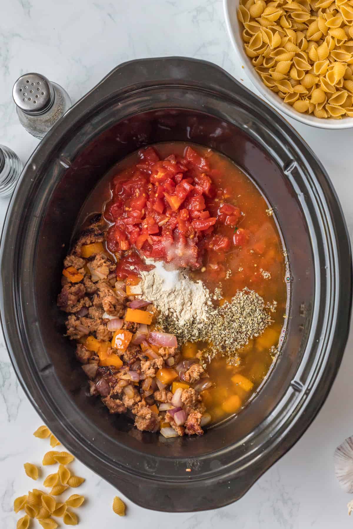adding the ingredients to the slow cooker.