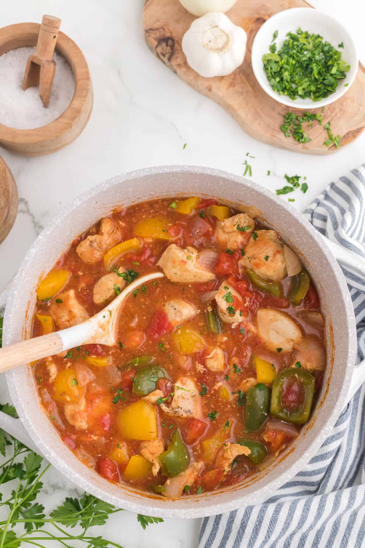 Chicken Goulash stew in a large pot with a serving spoon.