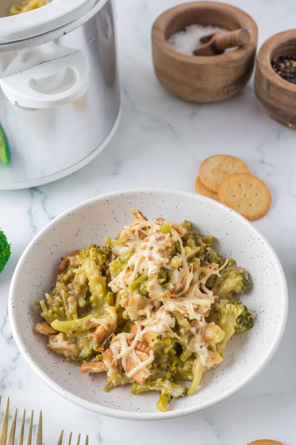 broccoli casserole serve in a white bowl.