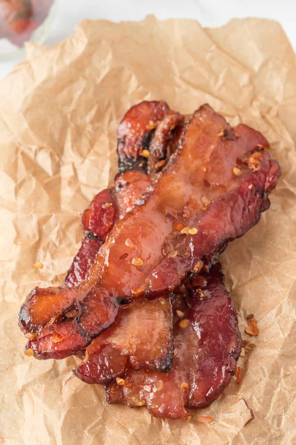 Cooked bacon on parchment paper.