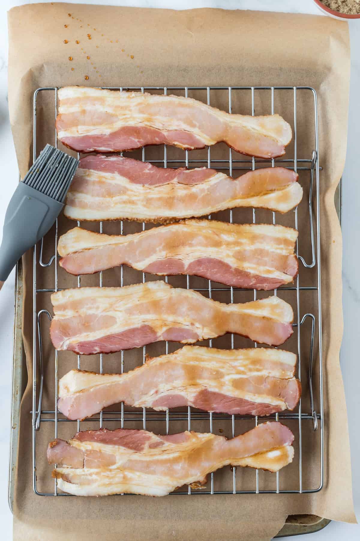 uncooked bacon on the waring rack