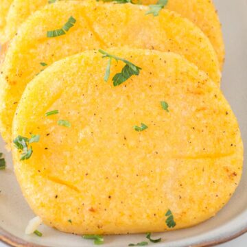 slice of polenta with chopped parsley.