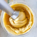 An ninja creami pean ice cream with a smooth, creamy texture inside a clear mixing bowl.